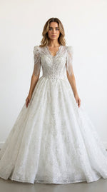 1289- Robe de mariée princesse perlée avec manches à franges